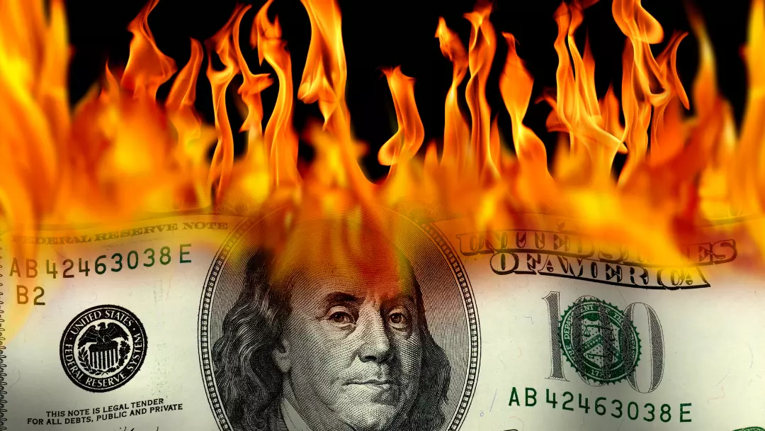 burning 100 dollar bill