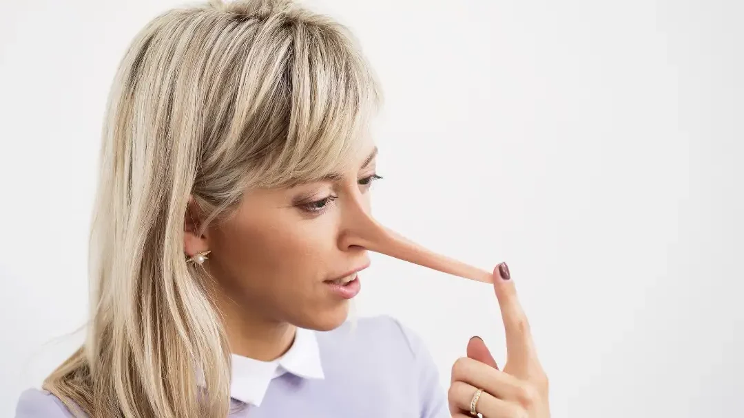 woman with nose growing from telling a lie like Pinocchio